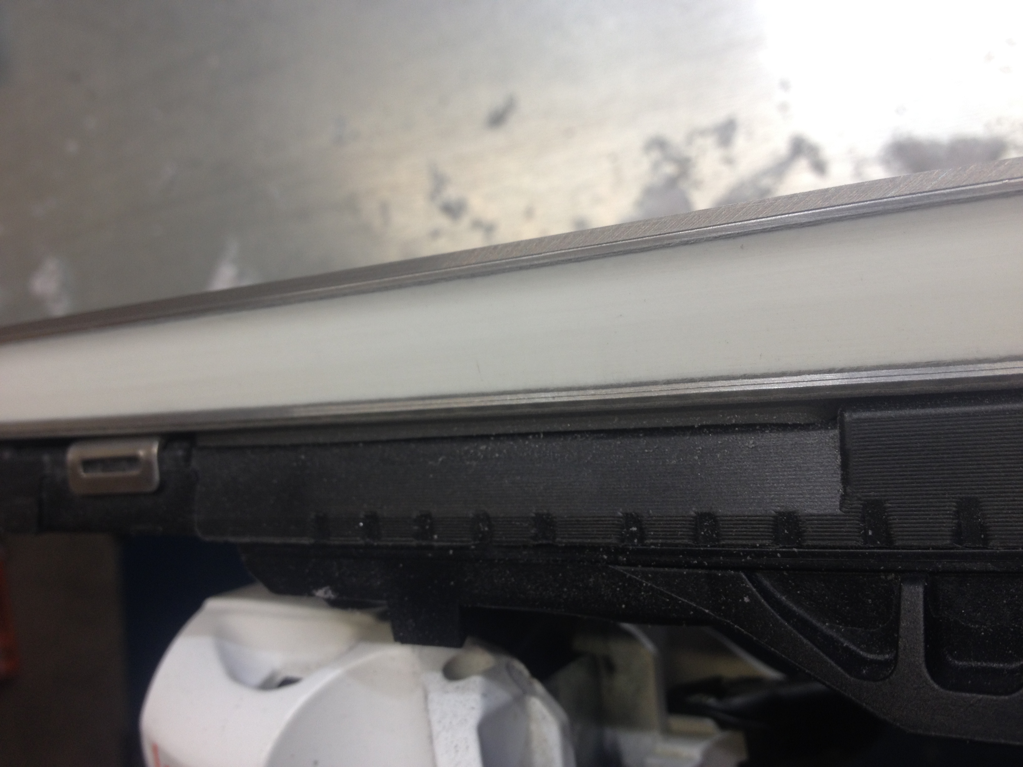 The sidewall after its excess has been removed and sanded smooth. Its important to sand the sidewall to be as smooth as possible in order to reduce friction when in contact with the snow.