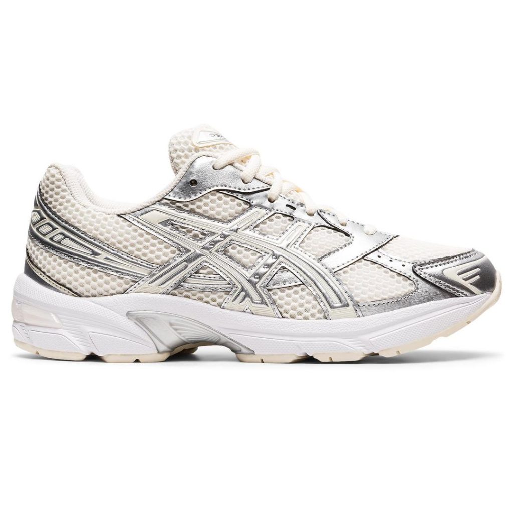Chunky off-white ASICS sneakers with large open hole mesh upper material and metallic silver overlays allover. Bright white sole with an eggshell colour rubber outsole. Off-white laces at the top.