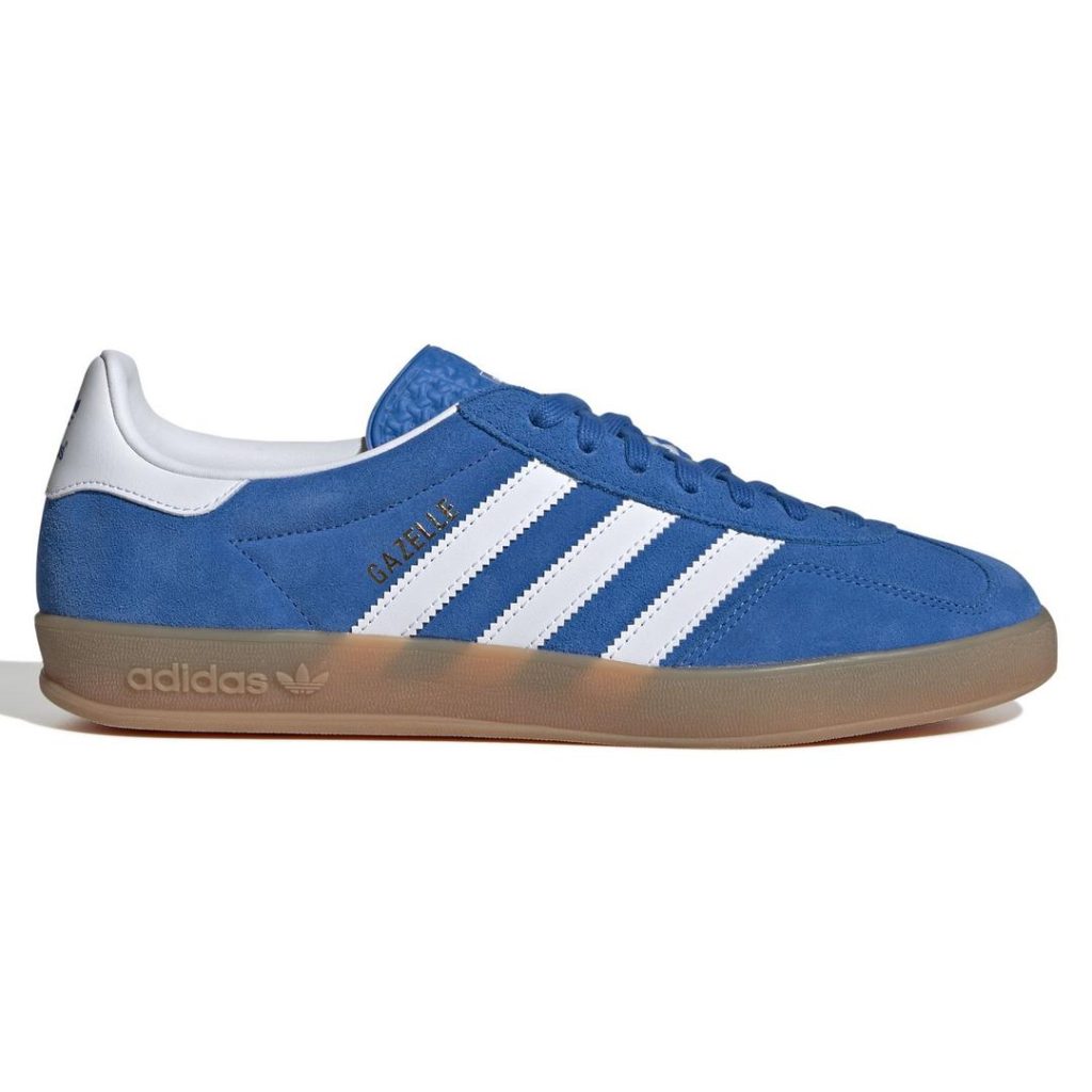 Low-profile blue suede adidas sneaker with contrast smooth white heel panel and white 3-Stripes detail at the side foot. Tonal blue laces at the top and a blue tongue. Brown gum rubber outsole with debossed adidas wordmark and Trefoil logo. follows 2025 back to school fashion trends