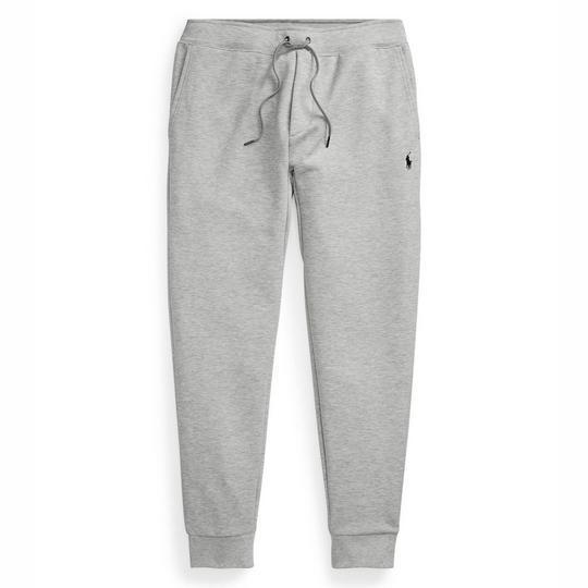 light grey jogger-style sweatpants from Polo Ralph Lauren with a drawstring at the waistband, tapered ribbed cuffs and a small contrast dark blue/black embroidered Pony logo at the left thigh; follows back to school fashion trends