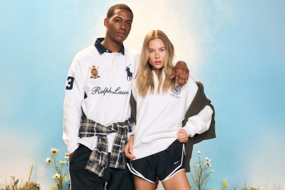 Man and woman in white Ralph Lauren and Nike sportswear against a blue sky.